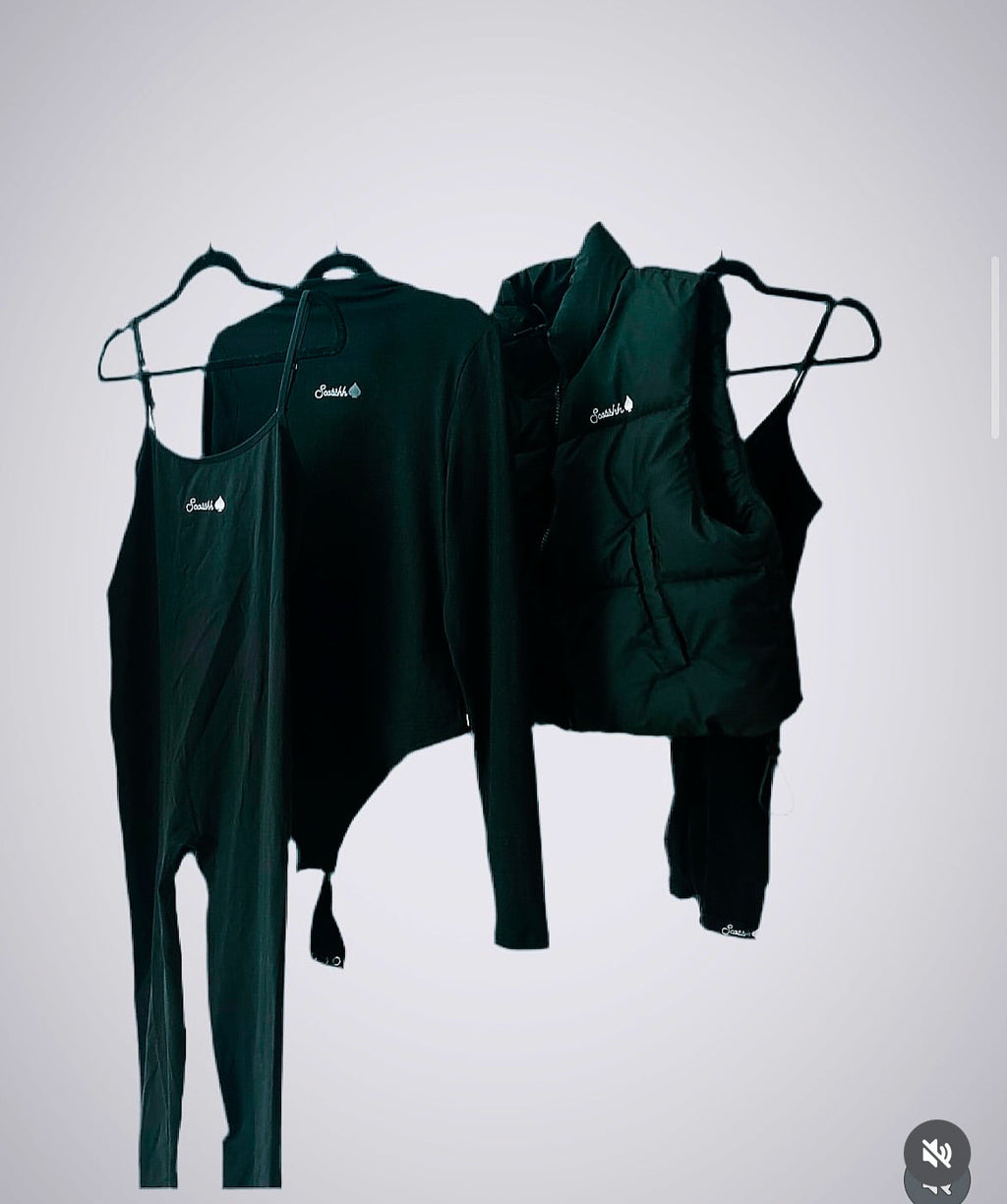 Black bodysuit with thong and turtleneck .